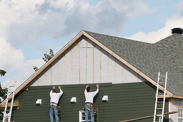 Professional Siding technician working in South Heights, PA